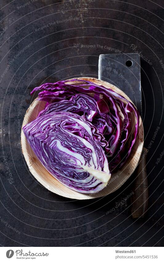 Sliced red cabbagein bowl and a cleaver on dark ground nobody vitamines chopping knife chopper cleavers choppers chopping knives purple copy space Red Cabbage