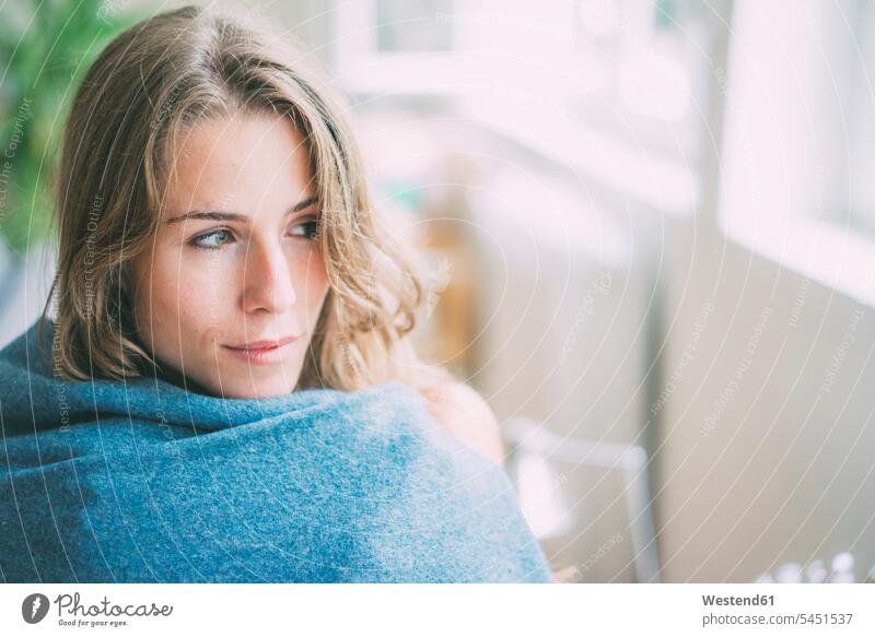 Portrait of young woman wrapped in a blanket Blanket Blankets portrait portraits females women Adults grown-ups grownups adult people persons human being humans