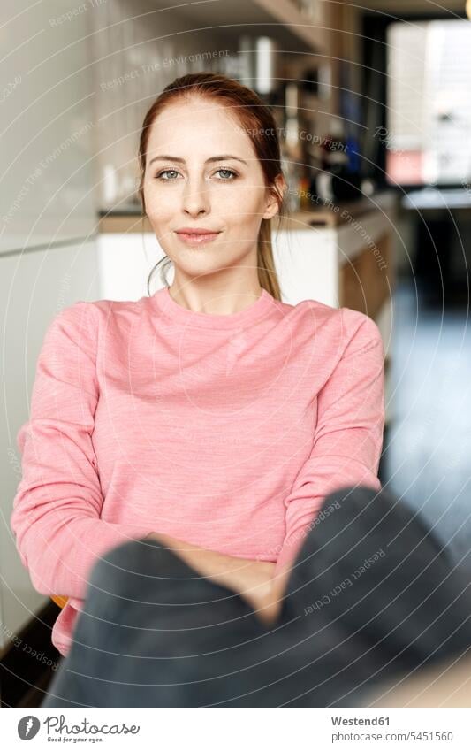 Portrait of smiling young woman at home portrait portraits smile females women sitting Seated Adults grown-ups grownups adult people persons human being humans