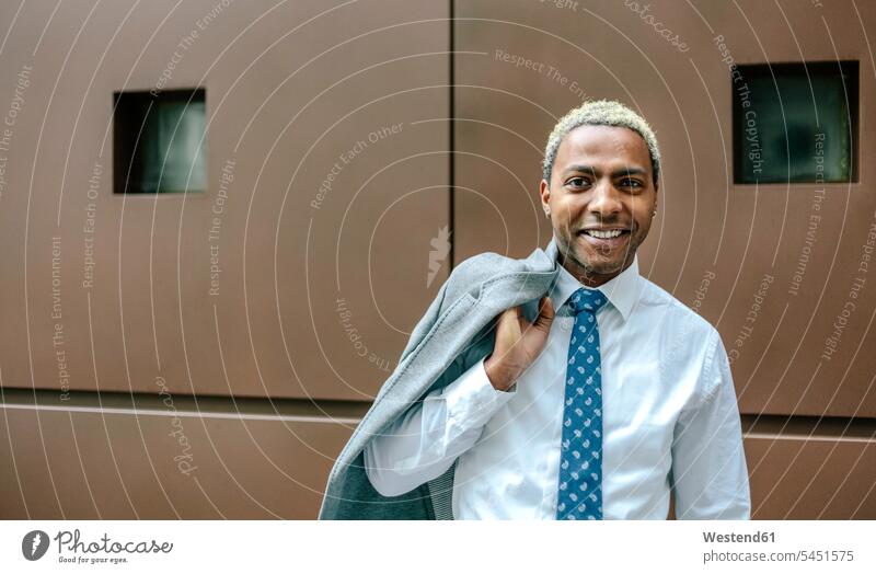 Black businessman with blond hair, portrait blonde hair Businessman Business man Businessmen Business men portraits people persons human being humans