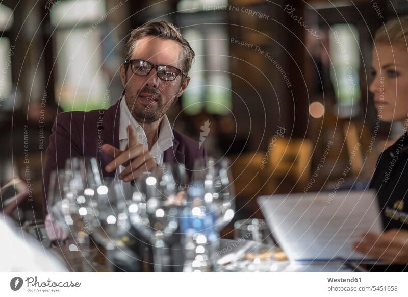 Man talking to waitress in restaurant restaurants caucasian caucasian ethnicity caucasian appearance european Glass Drinking Glasses indoors indoor shot