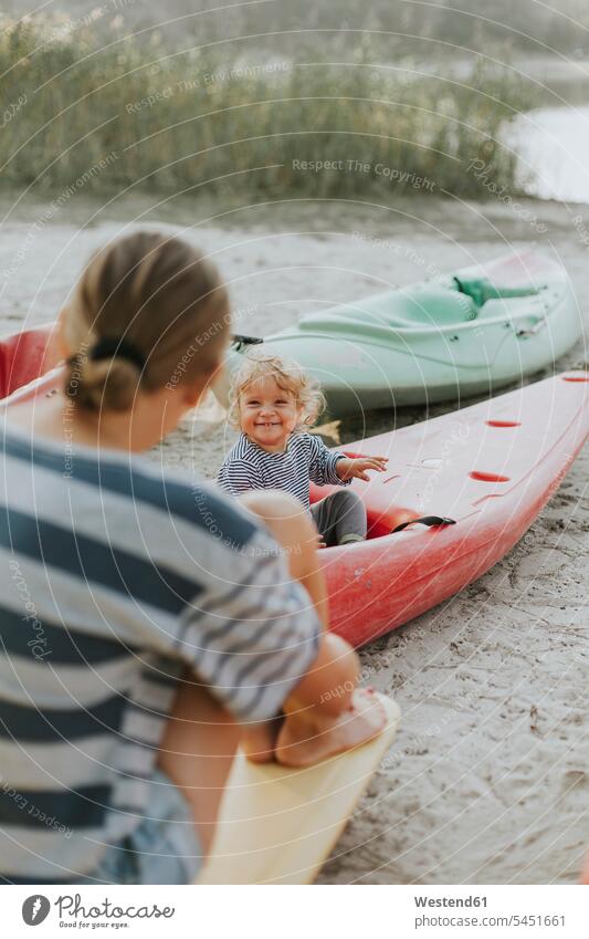 Netherlands, Schiermonnikoog, mother with little daughter in a boat boats daughters mommy mothers ma mummy mama sitting Seated smiling smile beach beaches child