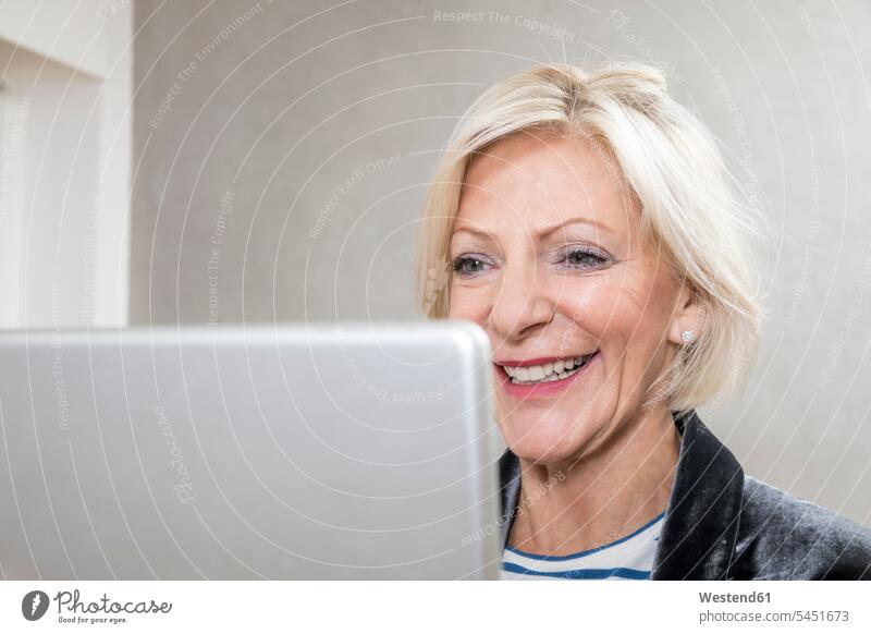 Portrait of happy senior woman using tablet portrait portraits digitizer Tablet Computer Tablet PC Tablet Computers iPad Digital Tablet digital tablets females