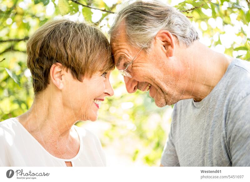 Happy senior couple outdoors head to head smiling smile twosomes partnership couples people persons human being humans human beings Germany toothy smile