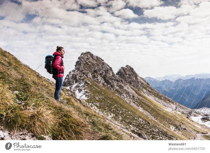 Germany, Bavaria, Oberstdorf, hiker in alpine scenery mountain range mountains mountain ranges hiking woman females women landscape landscapes terrain Adults