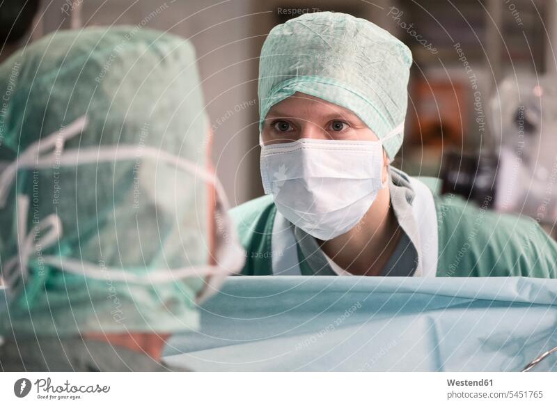 Two surgeons in operating room doctor physicians doctors surgery surgeries healthcare and medicine medical Healthcare And Medicines treatment Medical Treatment