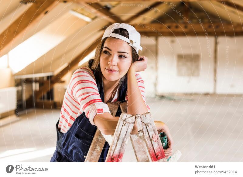 Young woman renovating her new home, holding paint roller DIY Doityourself Do it yourself Do-it-yourself home ownership private owned home renovation renovate
