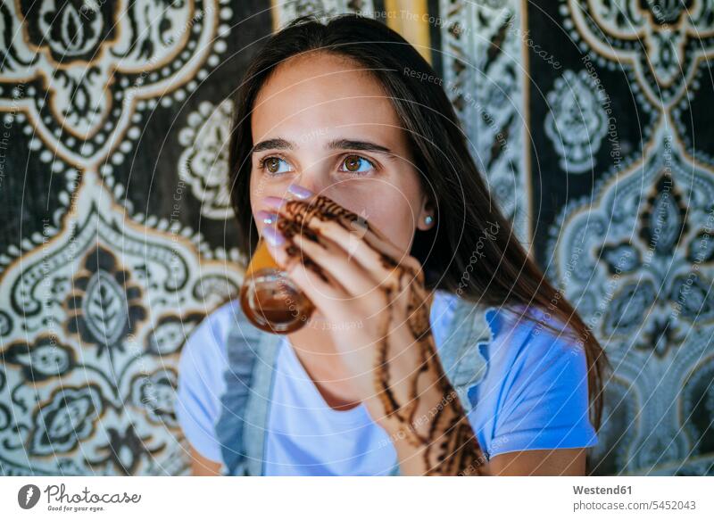 Morocco, portrait of woman with henna tattoo on her hand drinking glass of tea human hand hands human hands females women Henna Tattoo Mehdi portraits Glass