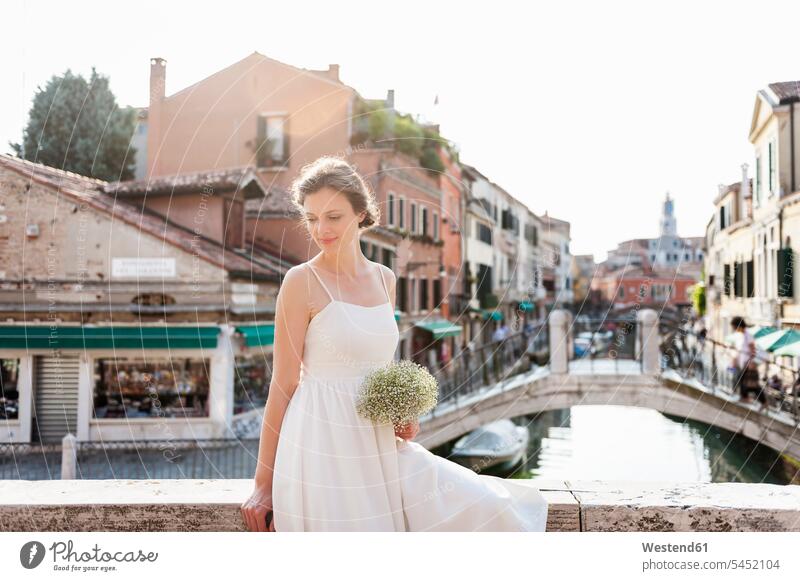Italy, Venice, smiling bride with bridal bouquet brides portrait portraits Wedding getting married marrying Marriage woman females women smile