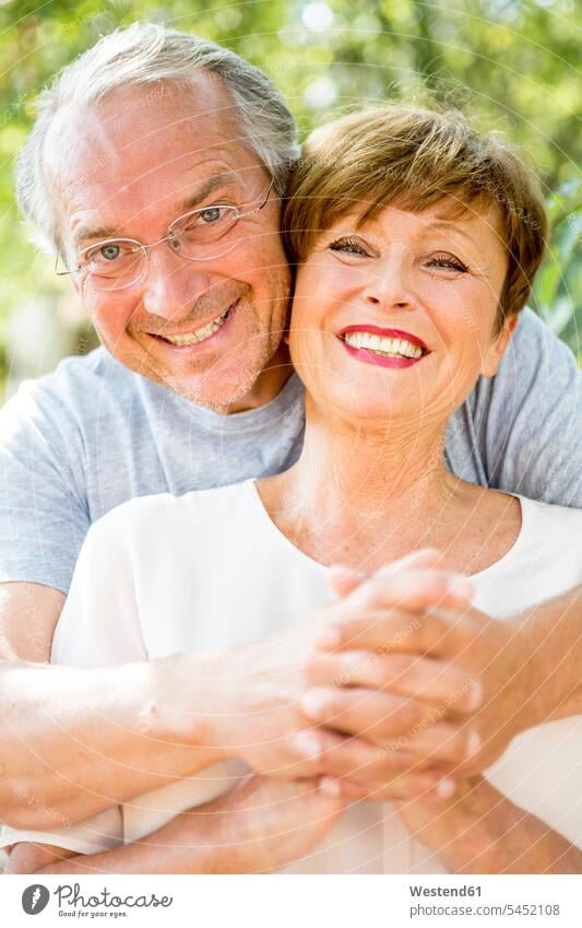 Portrait of happy senior couple outdoors embracing embrace Embracement hug hugging twosomes partnership couples smiling smile people persons human being humans