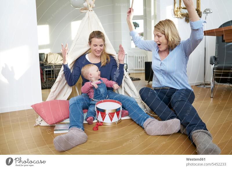 Happy grandmother, mother and baby girl playing at home Fun having fun funny laughing Laughter infants nurselings babies happiness happy mommy mothers ma mummy