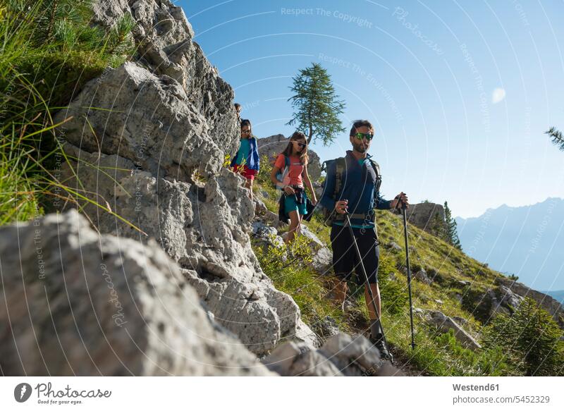 Italy, Friends trekking in the Dolomtes Dolomites Dolomite Alps active mountaineering friends mountain hike hiking climber alpinists climbers Mountain Climber