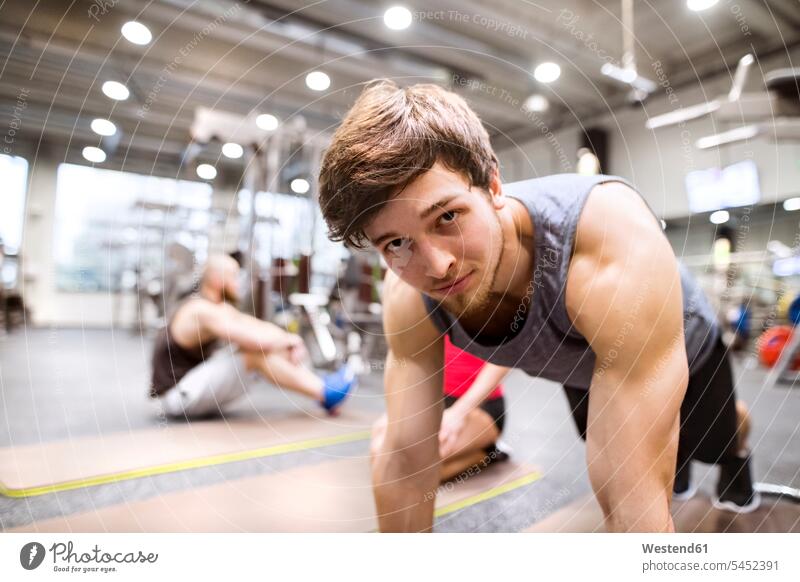 Portrait of young man exercising in gym exercise training practising athlete Sportspeople Sportsman Sportsperson athletes Sportsmen males pushup Push-up