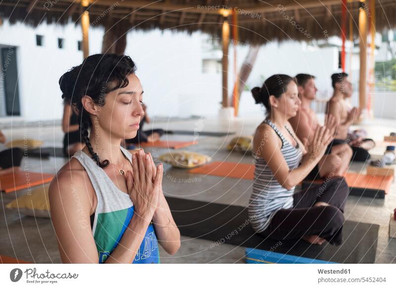 Yoga class meditating meditate relaxed relaxation focus on foreground Focus In The Foreground focus on the foreground leisure free time leisure time balance