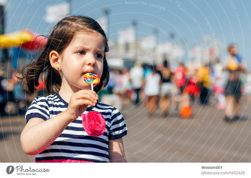 USA, New York, Coney Island, little girl with lollipop females girls Lollipop Lollipops Lolly child children kid kids people persons human being humans