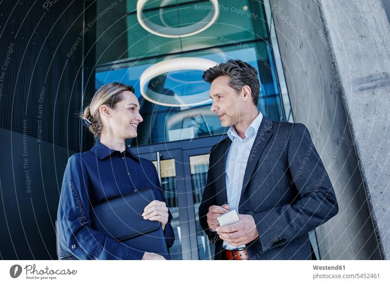Two business partners communicating business people businesspeople portrait portraits business world business life female business partner