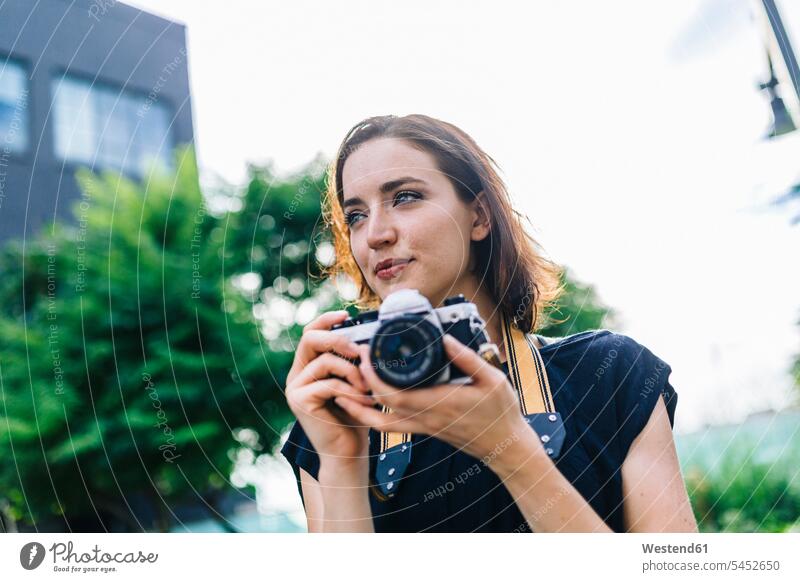 Portrait of woman with camera portrait portraits females women cameras Adults grown-ups grownups adult people persons human being humans human beings