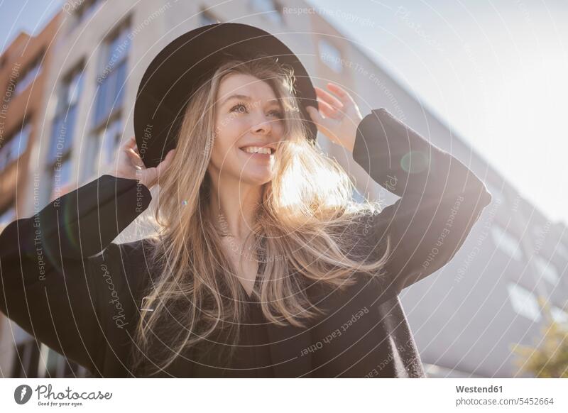 Portrait of happy woman with hat dressed in black hats females women portrait portraits happiness Adults grown-ups grownups adult people persons human being