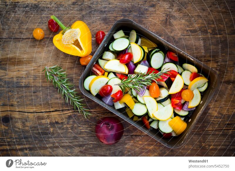 Raw Mediterranean oven vegetables on roasting tray Courgette Zucchinis Courgettes green sqash Aubergine eggplants Aubergines Yellow Bell Pepper