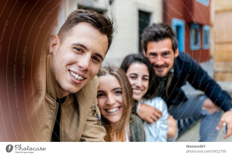 Selfie of friends in the city Selfies friendship smiling smile community Companionship personal perspective four people 4 self-portrait