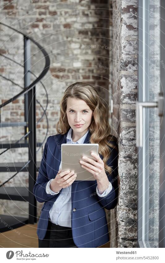 Portrait of confident businesswoman holding tablet digitizer Tablet Computer Tablet PC Tablet Computers iPad Digital Tablet digital tablets businesswomen