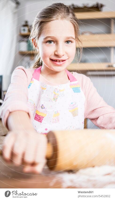 Portrait of smiling girl baking in kitchen females girls domestic kitchen kitchens bake child children kid kids people persons human being humans human beings