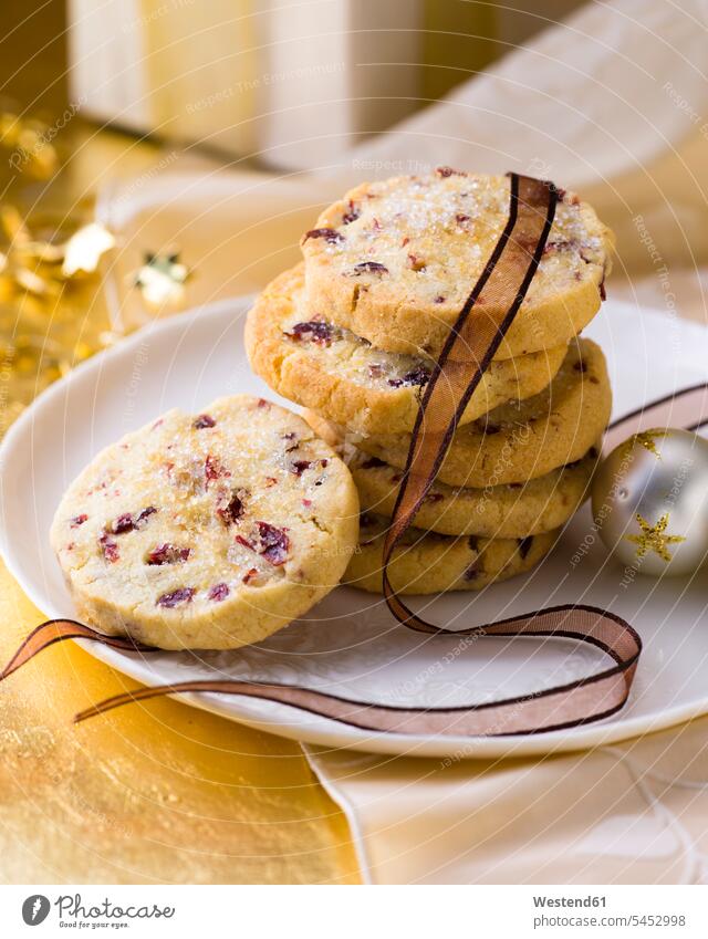 Stack of Cranberry Christmas Cookies Plate dish dishes Plates studio shot studio shots studio photograph studio photographs focus on foreground