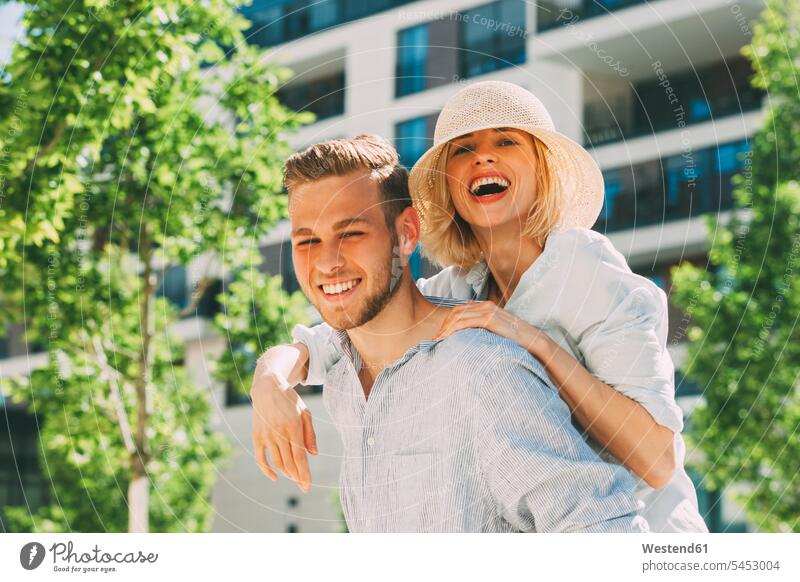 Portrait of happy couple having fun portrait portraits twosomes partnership couples laughing Laughter people persons human being humans human beings positive