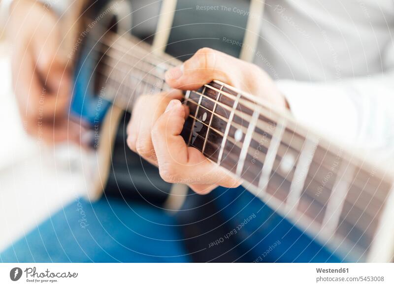 Man with acoustic guitar, close up making music playing music make music play music guitars hand human hand hands human hands stringed instrument