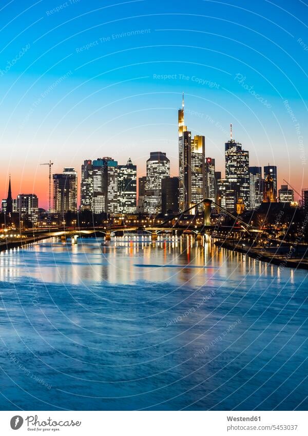 Germany, Frankfurt, view to skyline with Floesserbruecke and Main River in the foreground at twilight Hessische Landesbank Helaba outdoors outdoor shots