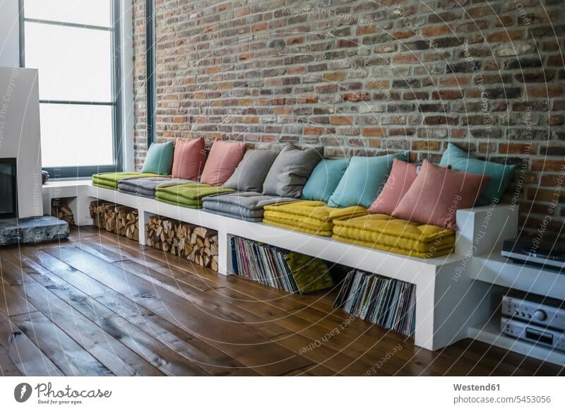 Germany, Living room interior of a country house cushion cushions cozy sociable comfortable cosy home at home Lifestyles firewood Firewoods copy space Absence