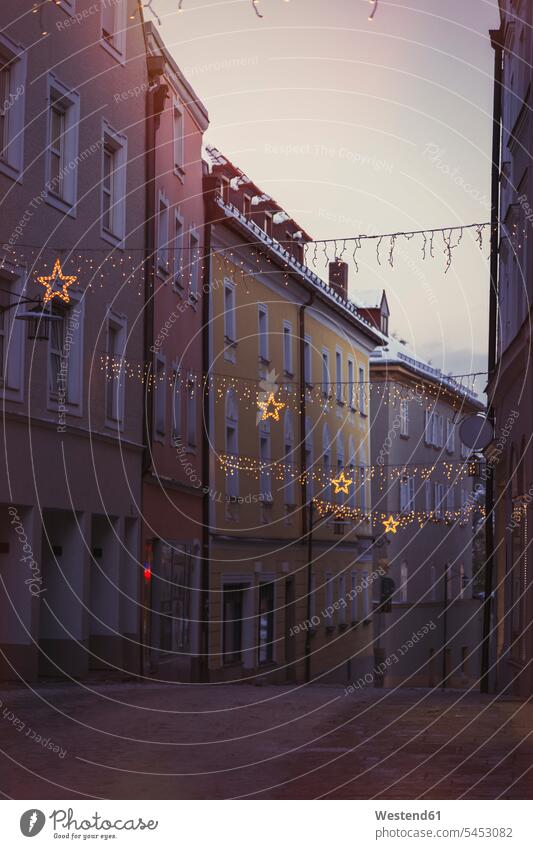Germany, Passau, Christmas illumination between houses in the old town Connection connected Connections connectivity evening light lighting outdoors
