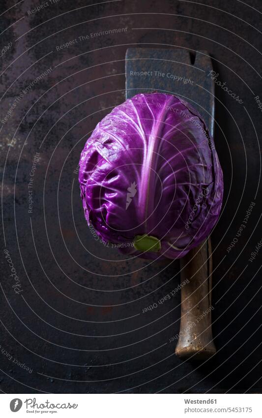 Purple Sweetheart Cabbage and cleaver on dark ground Pointed Cabbage Freshness fresh healthy eating nutrition vitamines uncooked raw whole old two objects 2