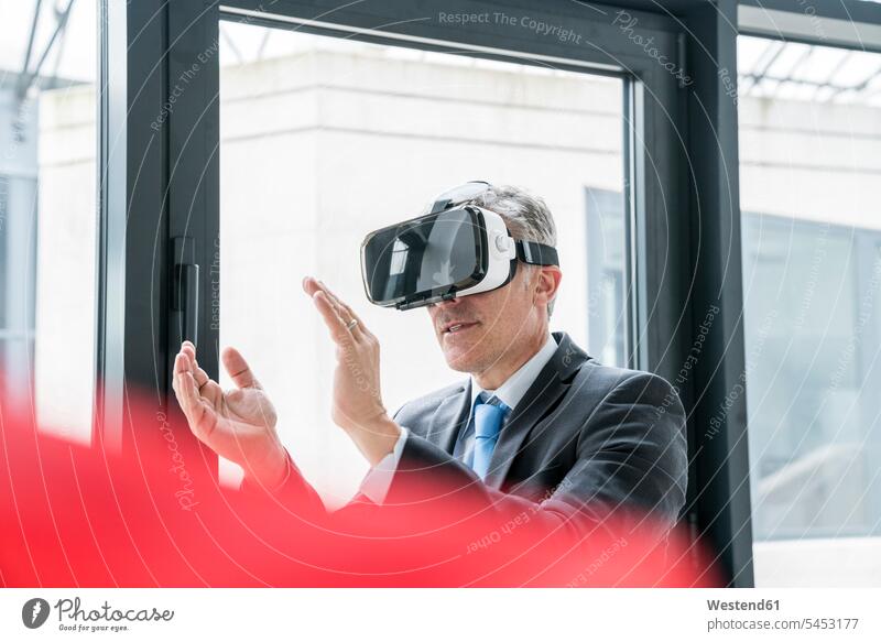 Businessman using VR goggles architect architects Innovation office offices office room office rooms Business man Businessmen Business men Vision Visions