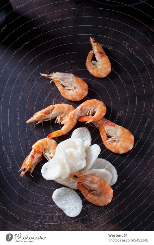 Prawn crackers and shrimps on dark ground overhead view from above top view Overhead Overhead Shot View From Above white Freshness fresh Shrimp Shrimps Scampis
