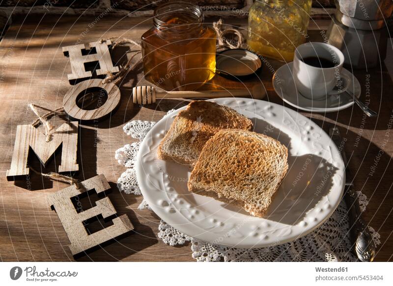 Breakfast table with toast, orange marmalade, honey and espresso Glass Glasses hot beverage hot beverages sweet Sugary sweets wooden elevated view