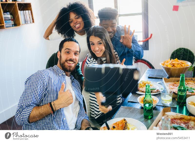 Group of friends posing for a selfie at dining table at home mobile phone mobiles mobile phones Cellphone cell phone cell phones Selfie Selfies Fun having fun