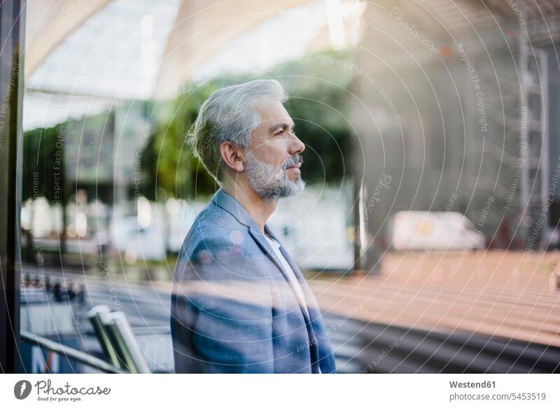 Portrait of grey-haired businessman outdoors beard portrait portraits Businessman Business man Businessmen Business men standing people persons human being