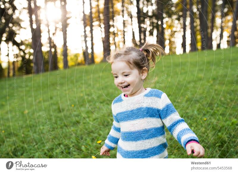 Happy girl on meadow laughing Laughter meadows happiness happy females girls positive Emotion Feeling Feelings Sentiments Emotions emotional child children kid