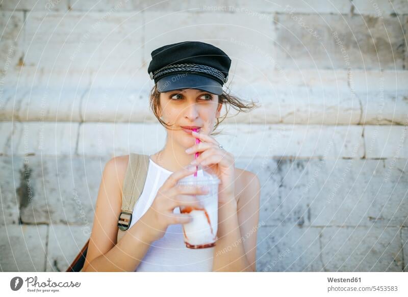 Portrait of young woman drinking a smoothie Smoothies females women Drink beverages Drinks Beverage food and drink Nutrition Alimentation Food and Drinks Adults
