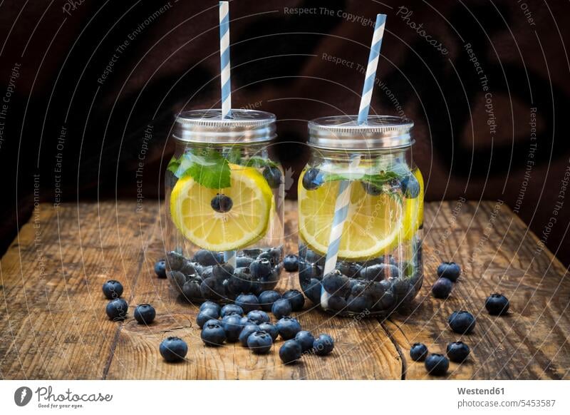Two glasses of infused water with lemon slices, blueberries and mint studio shot studio shots studio photograph studio photographs cover lid Lids healthy