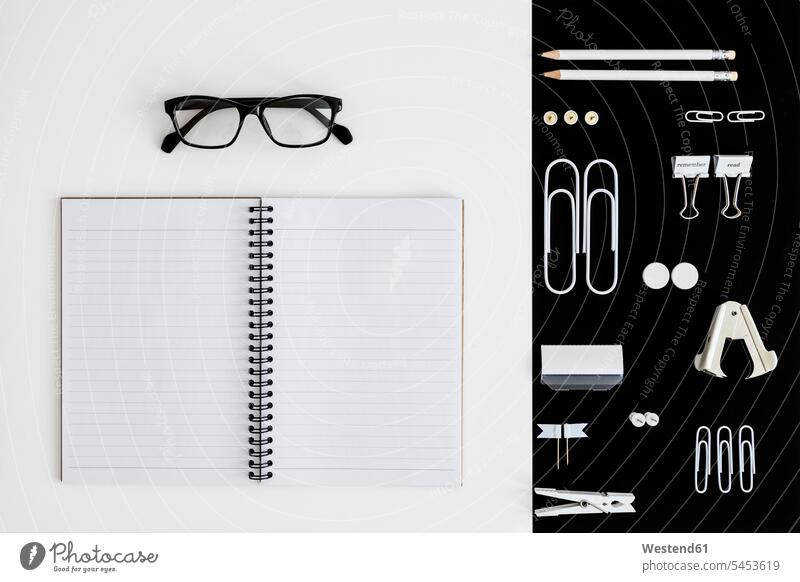 White office utensils on black background and notepad and glasses on whilte background opened offices office room office rooms specs Eye Glasses spectacles