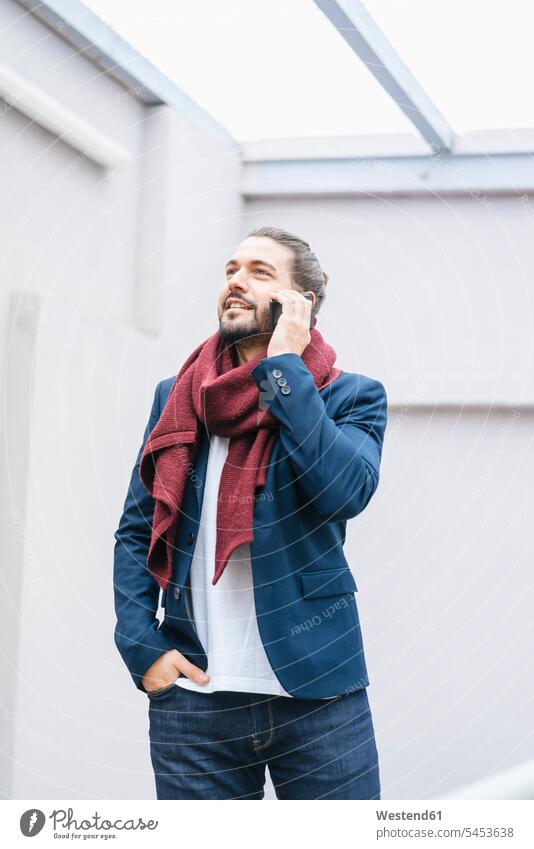 Portrait of smiling businessman on the phone wearing scarf call telephoning On The Telephone calling Businessman Business man Businessmen Business men