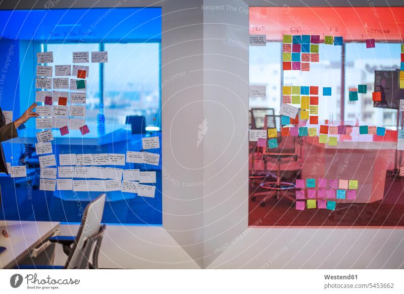 Sticky notes on a glass pane in modern office caucasian caucasian ethnicity caucasian appearance european professional professionalism Dedication Engagement