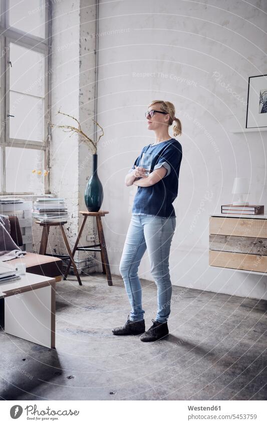Woman standing in a loft freelancer freelancing lofts creative professional Creative People creatives Creative Occupation creative professionals woman females