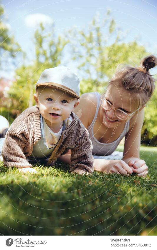 Portrait of baby boy with his mother on a meadow in the garden portrait portraits baby boys male infants nurselings babies people persons human being humans