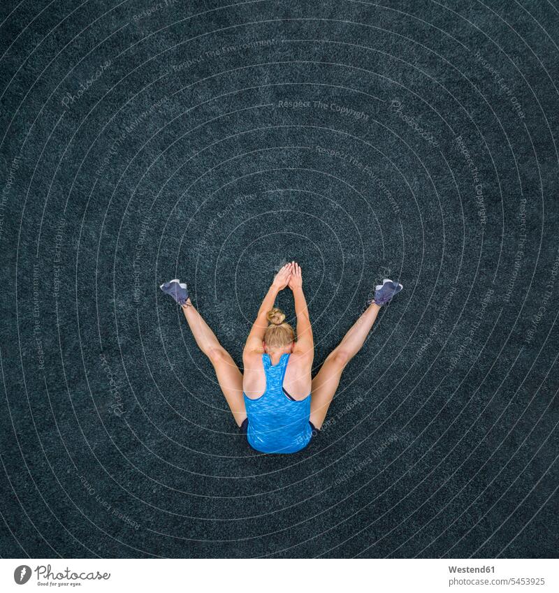 Young woman doing gymnastics, top view athlete sportswoman athletes female athlete sportswomen female athletes Sportspeople Sportsman Sportsperson Sportsmen