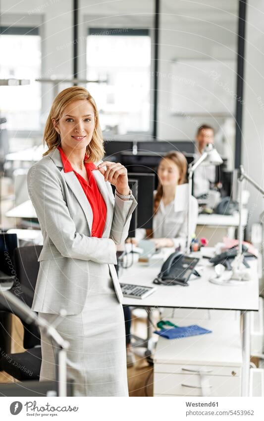 Portait of smiling businesswoman in office smile offices office room office rooms businesswomen business woman business women workplace work place place of work