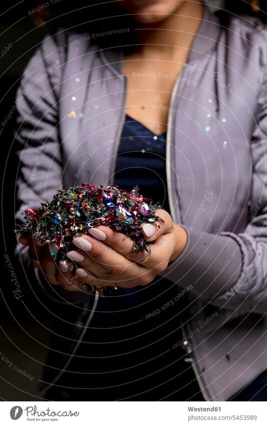 Woman's hands holding confetti human hand human hands woman females women people persons human being humans human beings Adults grown-ups grownups adult