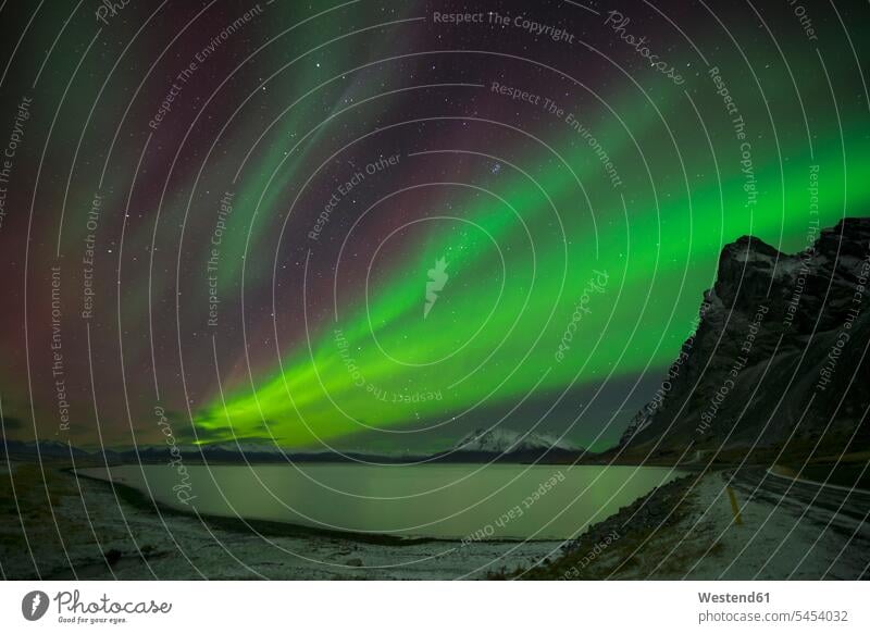 Iceland, scenery with Aurora Borealis beauty of nature beauty in nature brightness glare luminescent natural world Darkness mountain mountains outdoors
